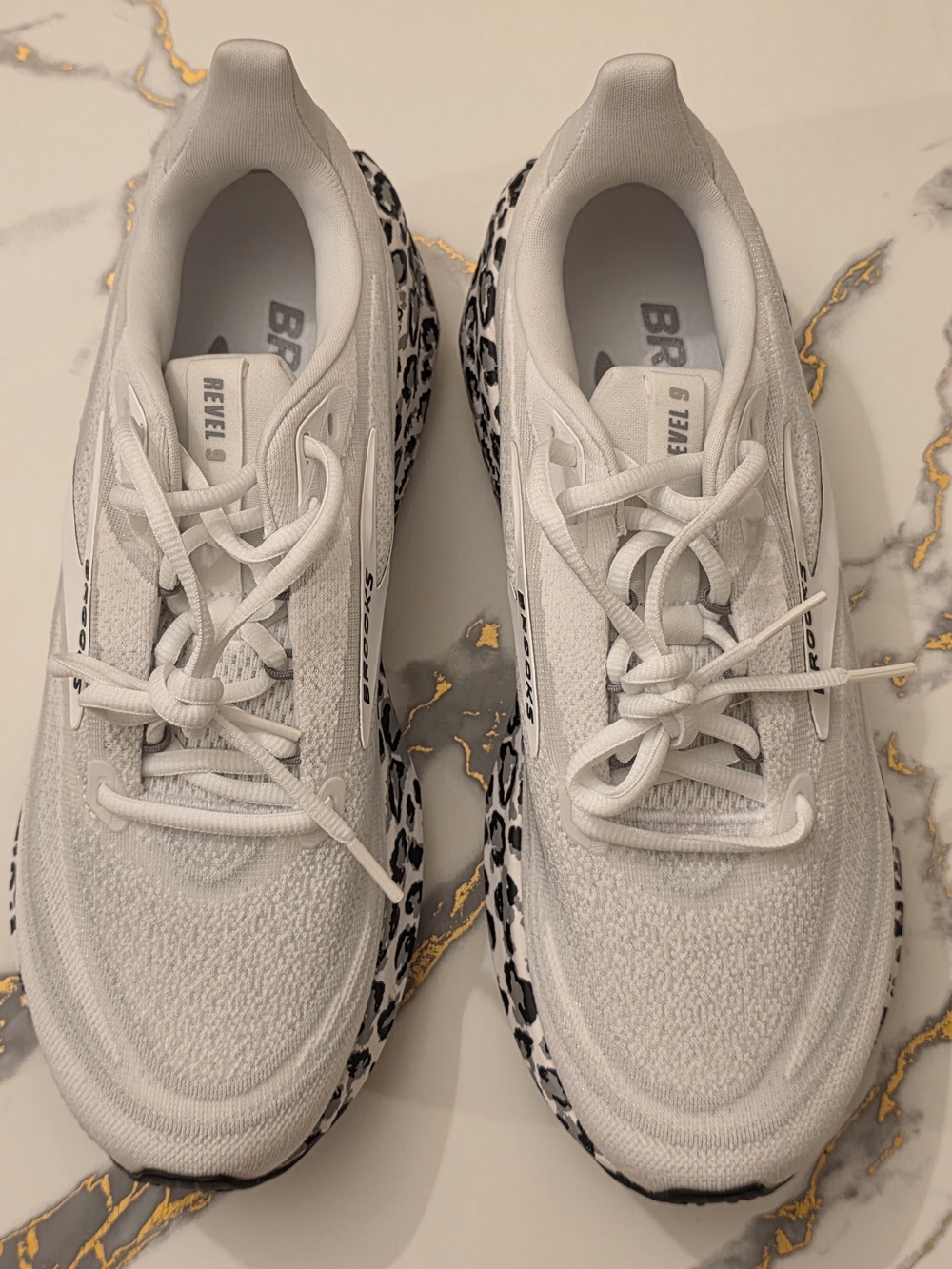 Brooks Revel 9 White Sneakers with Black Leopard soles